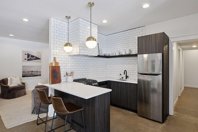 2070 Shoreline Dr, Orono, MN 55391 - kitchen featuring freestanding refrigerator, open shelves, a breakfast bar area, a peninsula, and stove