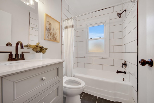 full bathroom featuring tile patterned flooring, shower / bath combo with shower curtain, vanity, and toilet