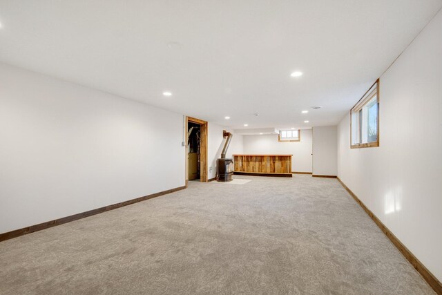 interior space featuring light colored carpet and a walk in closet