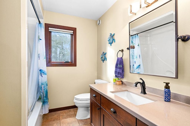 bathroom featuring toilet, shower / bath combo, baseboards, and vanity