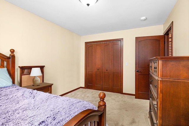 bedroom featuring a closet, carpet, and baseboards