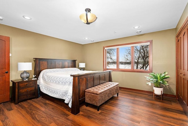 bedroom with wood finished floors and recessed lighting