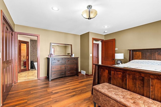 bedroom featuring recessed lighting, visible vents, dark wood finished floors, and baseboards