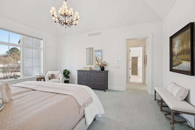 bedroom featuring light colored carpet and a notable chandelier