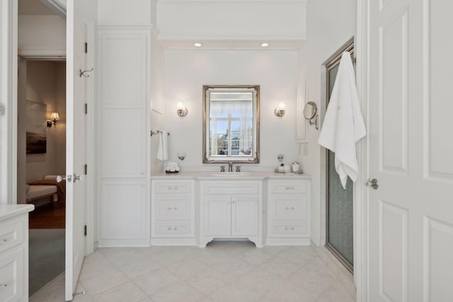 bathroom featuring vanity and an enclosed shower