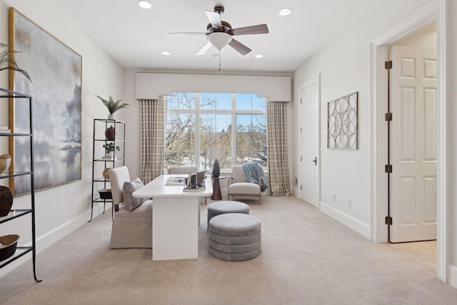 sitting room featuring ceiling fan and light colored carpet