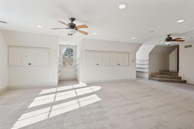 bonus room featuring light carpet and ceiling fan