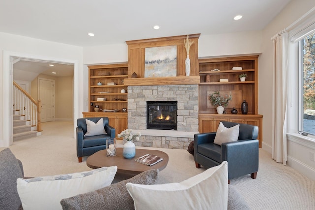 carpeted living room featuring a fireplace