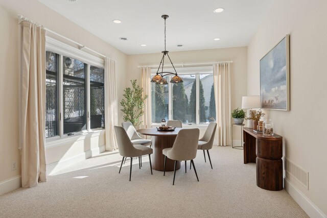 view of carpeted dining space