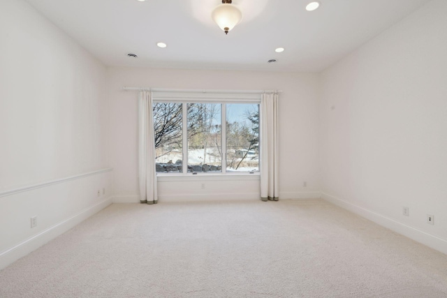 empty room with light colored carpet