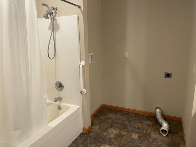 bathroom with shower / bath combo with shower curtain