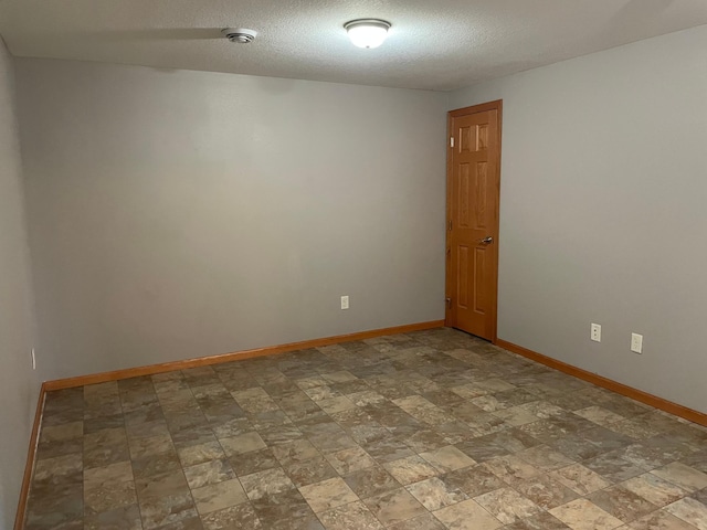 spare room featuring a textured ceiling