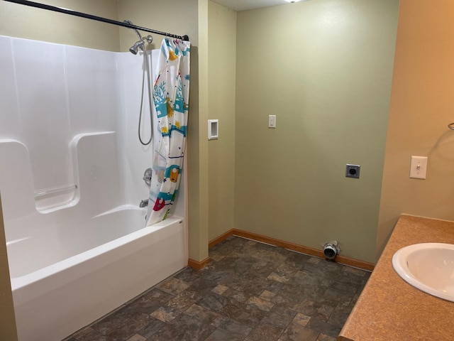 bathroom with vanity and shower / bath combo with shower curtain