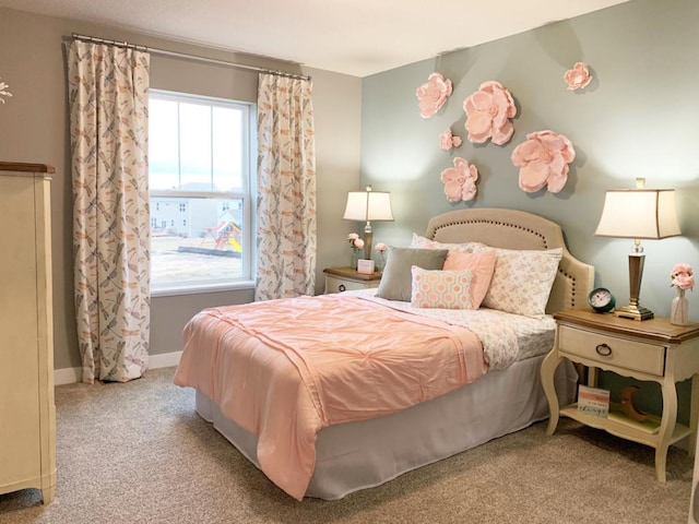 bedroom featuring light carpet