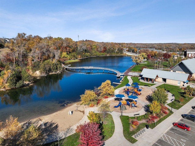 birds eye view of property with a water view