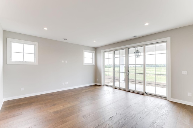 unfurnished room featuring wood-type flooring