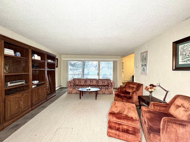 carpeted living area featuring a textured ceiling, a textured wall, and baseboard heating