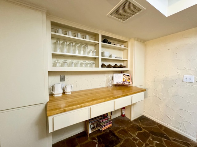 interior space featuring visible vents and baseboards