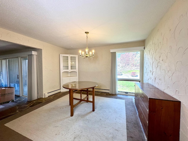 dining area featuring a baseboard radiator, a textured ceiling, a textured wall, and a notable chandelier