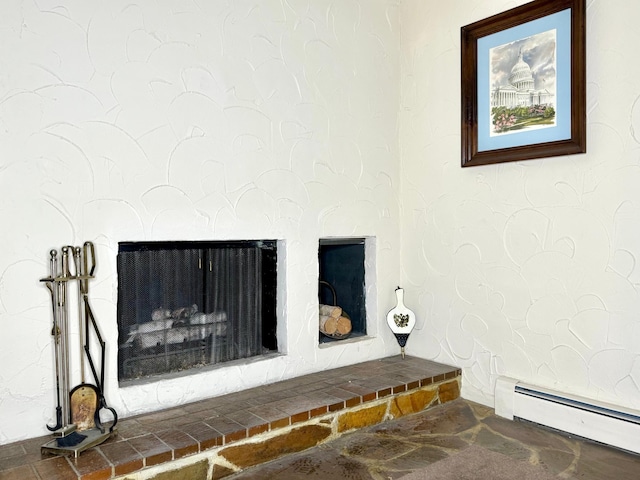 room details featuring a fireplace with raised hearth and baseboard heating