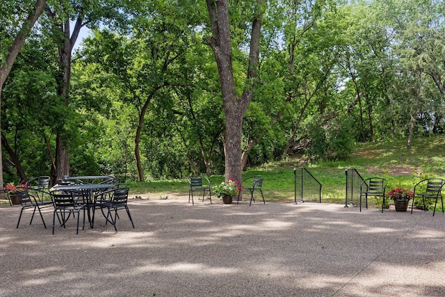 exterior space with outdoor dining area and a patio area