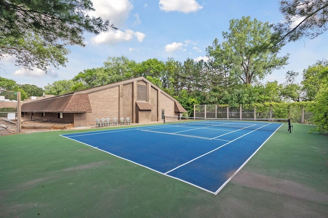 view of sport court with fence