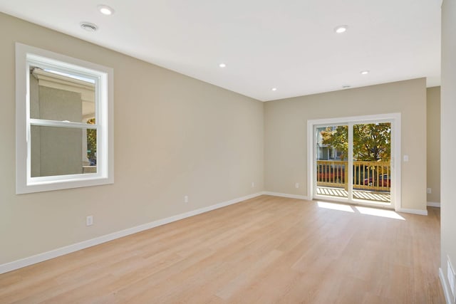 unfurnished room featuring light wood-type flooring