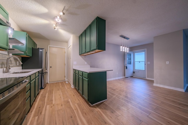 kitchen with light hardwood / wood-style floors, range, sink, and green cabinetry