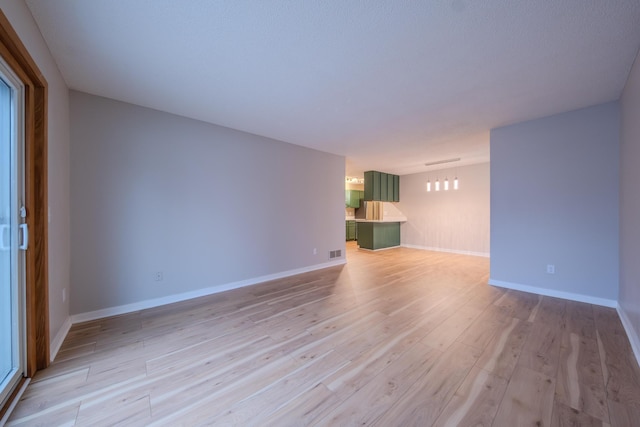 unfurnished living room featuring light hardwood / wood-style floors