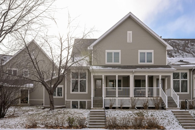 view of front of house with a porch and stairway