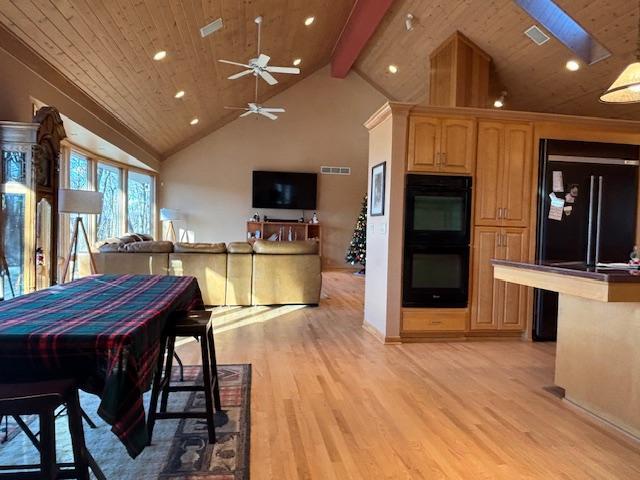 dining area with ceiling fan, beam ceiling, wooden ceiling, and light hardwood / wood-style flooring