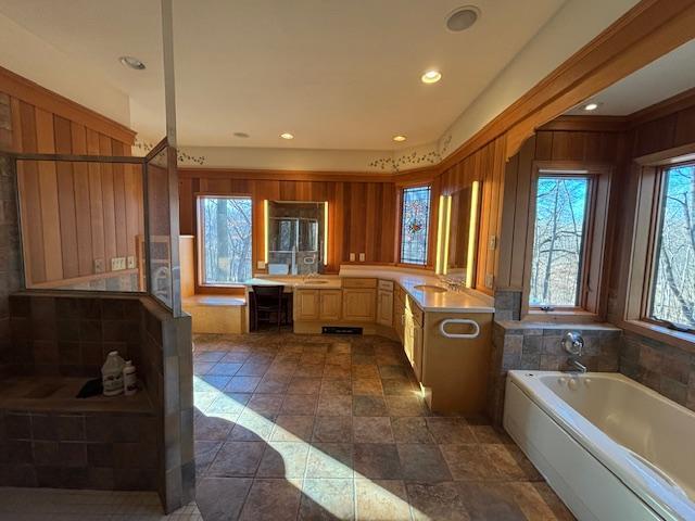 bathroom featuring a bathing tub and vanity