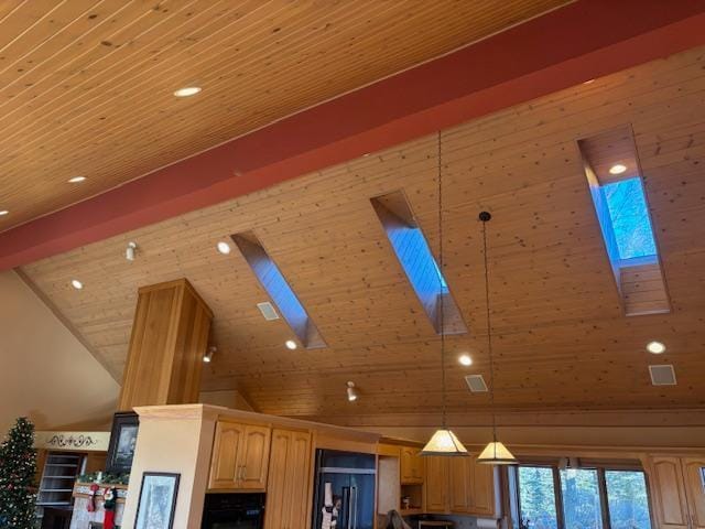 interior details with black appliances, wood ceiling, hanging light fixtures, and a skylight