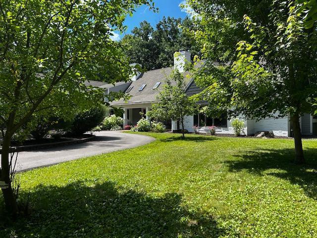 11233 Chisago Blvd, Chisago City, MN 55013 - view of grassy yard featuring asphalt driveway