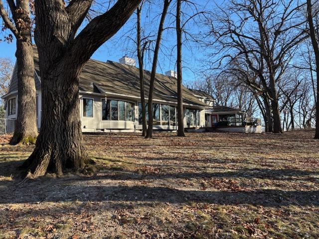 11233 Chisago Blvd, Chisago City, MN 55013 - view of front of home featuring a chimney