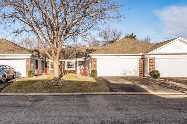 single story home with a garage and a front yard