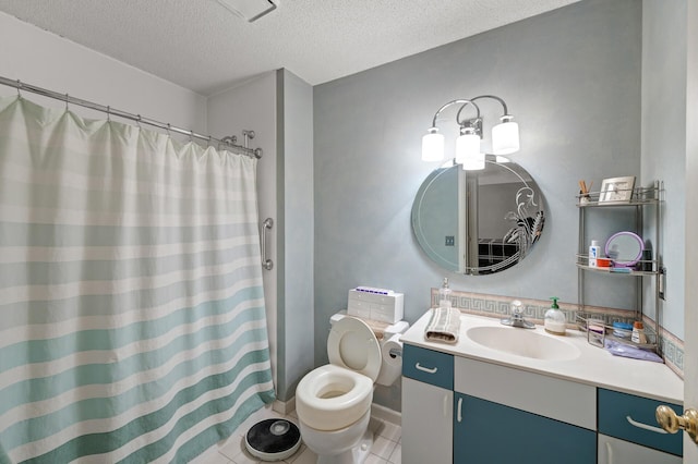 bathroom featuring curtained shower, vanity, toilet, tile patterned floors, and a textured ceiling