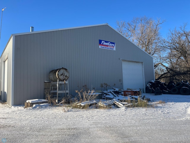 view of snow covered garage