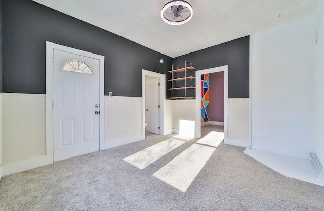 view of carpeted foyer