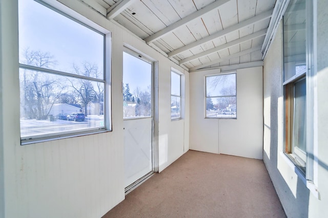 unfurnished sunroom with wood ceiling and lofted ceiling with beams