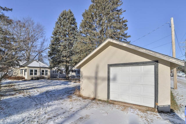 view of snow covered garage