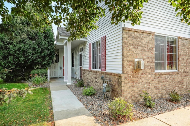 view of property exterior with a porch