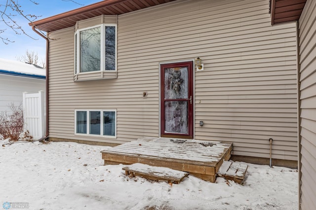 view of snow covered property entrance