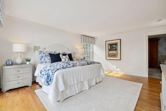 2496 Old Beach Rd, Orono, MN 55391 - bedroom featuring light wood finished floors, ornamental molding, and baseboards