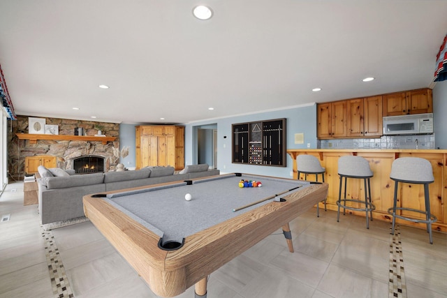 2496 Old Beach Rd, Orono, MN 55391 - playroom with recessed lighting, a fireplace, pool table, and crown molding