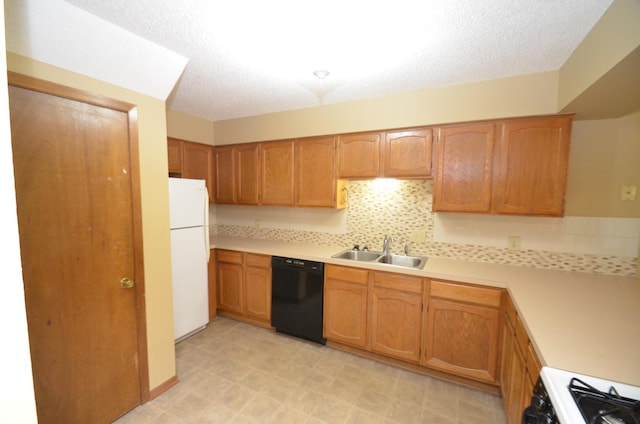 kitchen featuring a textured ceiling, decorative backsplash, white appliances, and sink