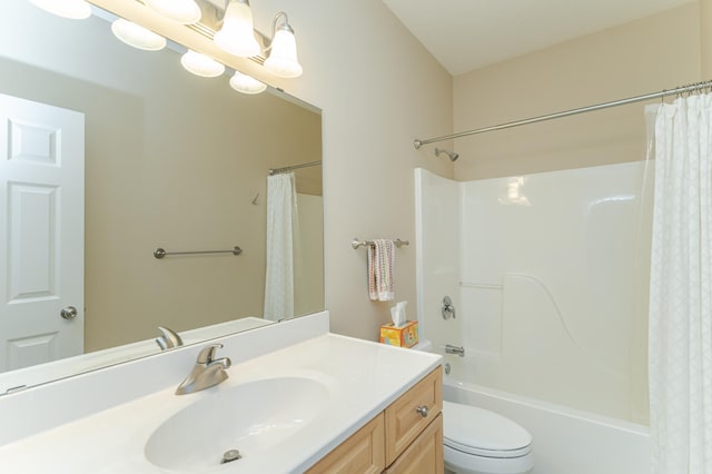 full bathroom featuring shower / bath combination with curtain, vanity, and toilet