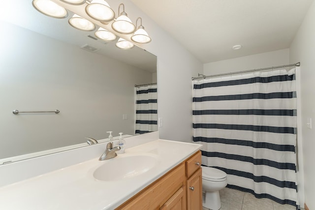 bathroom with tile patterned flooring, vanity, curtained shower, and toilet