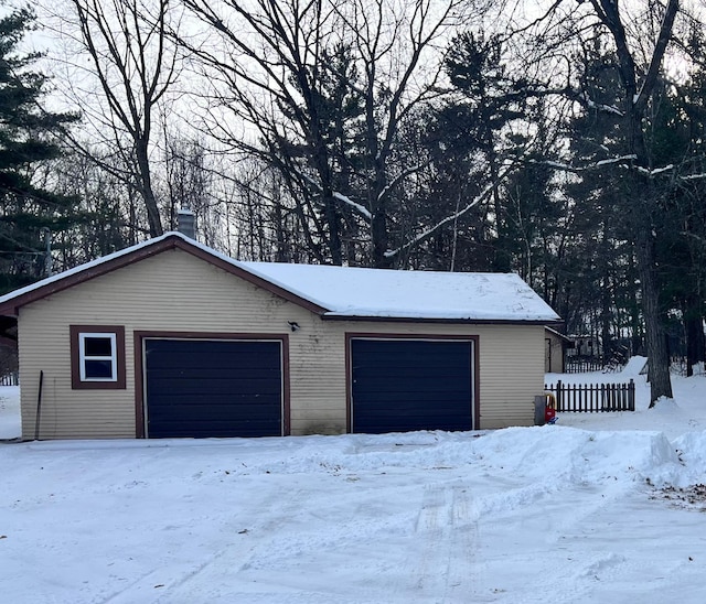 view of snow covered garage