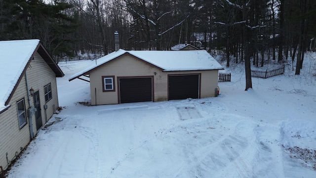 view of snow covered garage